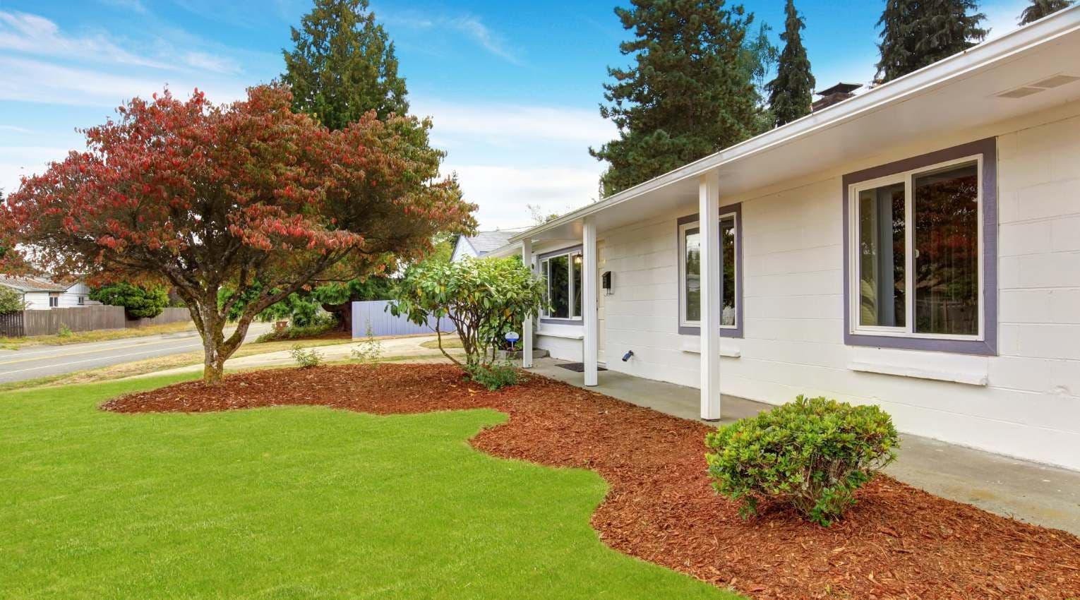 exterior of single-level white brick home